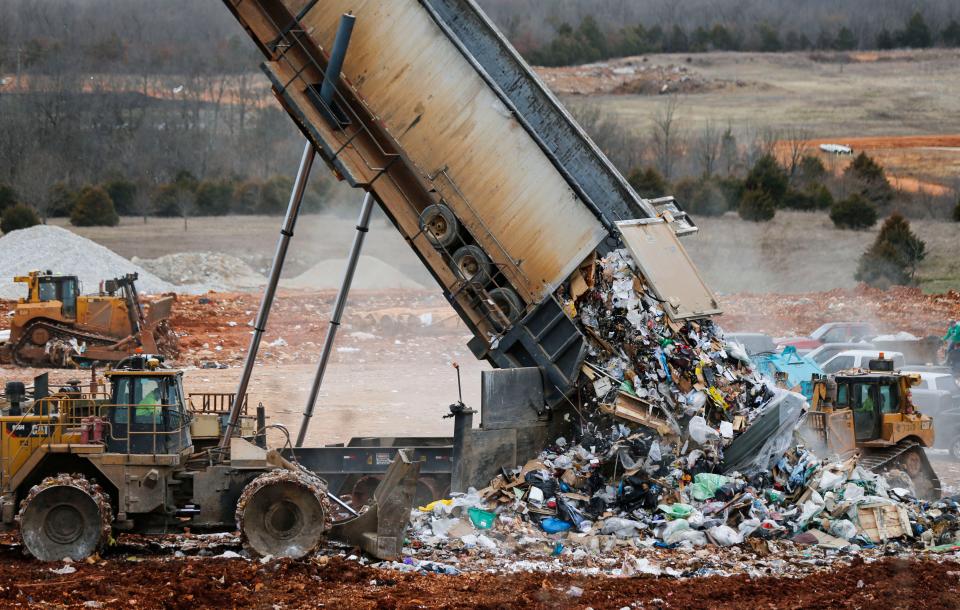 A landfill tipper raises a semi-trailer from a waste transfer station to dump its load into the Springfield Noble Hill Sanitary Landfill in Willard on Thursday, March 2, 2023.