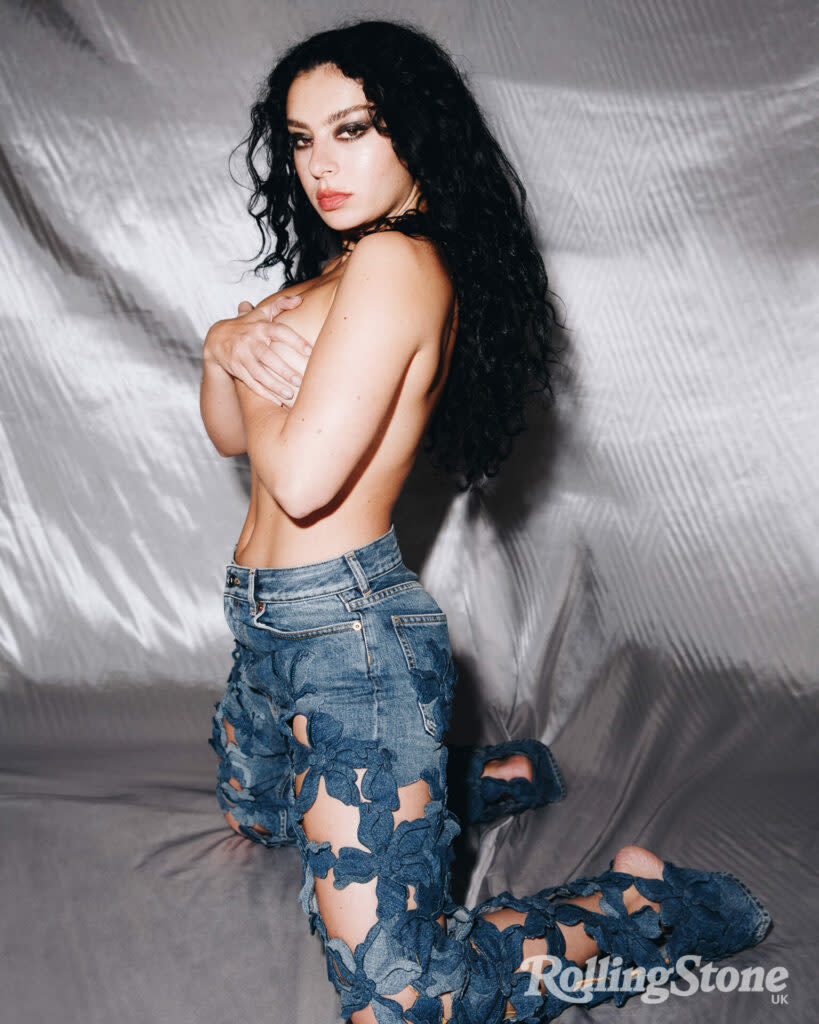 Charli wears jeans by Maison Valentino (Picture: Tyrell Hampton)