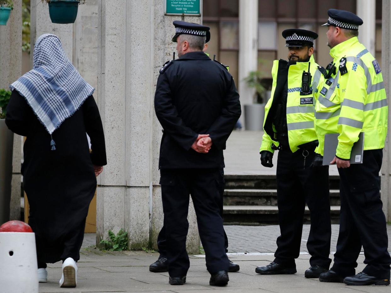 Police officers stand guard as worshippers arrive for Friday Prayers at London Central Mosque near Regent's Park in London on February 21, 2020: (Photo by TOLGA AKMEN/AFP via Getty Images)