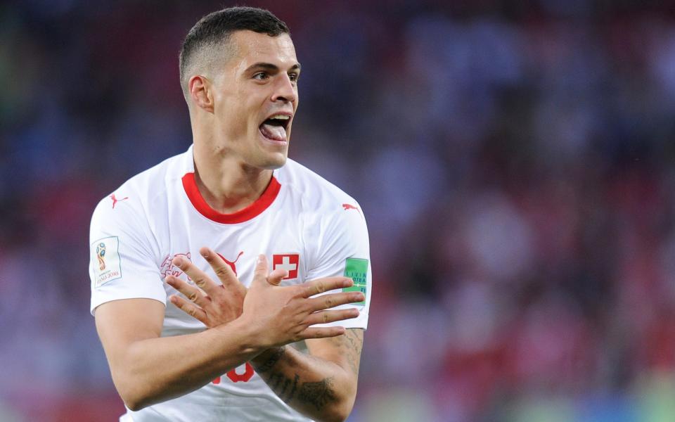 Granit Xhaka celebrates scoring for Switzerland against Serbia