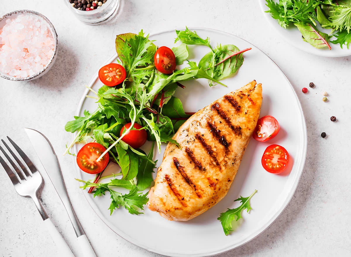 healthy plate filled with salad and grilled chicken