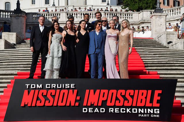 <p>TIZIANA FABI/AFP via Getty</p> The cast of Mission: Impossible—Dead Reckoning Part One in Rome.
