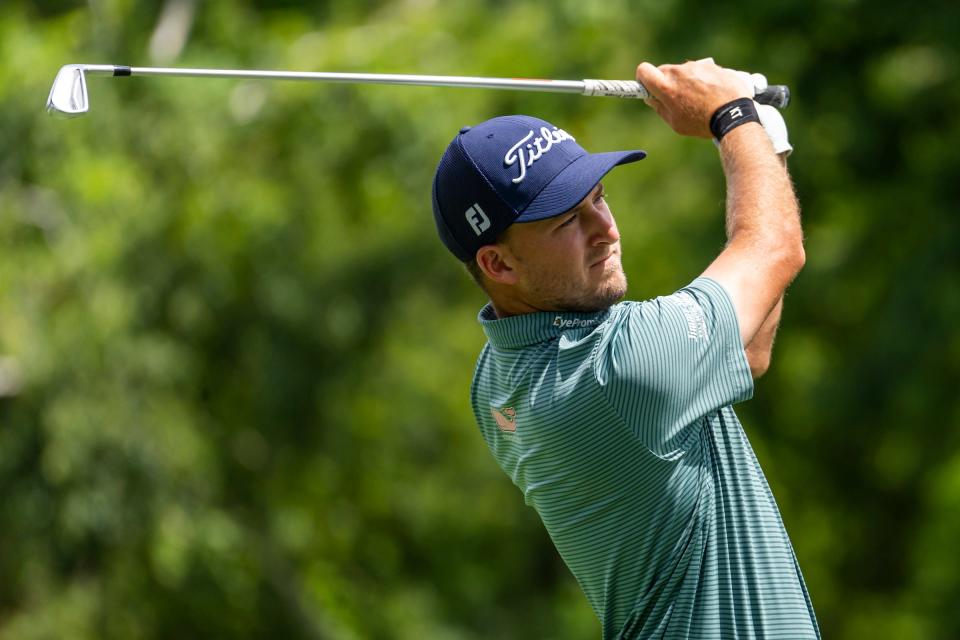 Lee Hodges hits his tee shot on the par 3 ninth hole during the first round of the Rocket Mortgage Classic on Thursday, July 28, 2022, at Detroit Golf Club.