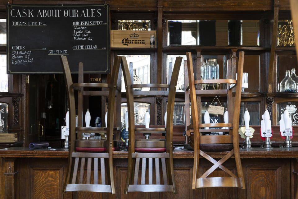 LONDON, ENGLAND  - MAY 18: Stools are placed on a bar in a closed pub in Clapham Junction on May 18, 2020 in London, England. The British government has started easing the lockdown it imposed two months ago to curb the spread of Covid-19, abandoning its 'stay at home' slogan in favour of a message to 'be alert', but UK countries have varied in their approaches to relaxing quarantine measures. (Photo by Dan Kitwood/Getty Images)