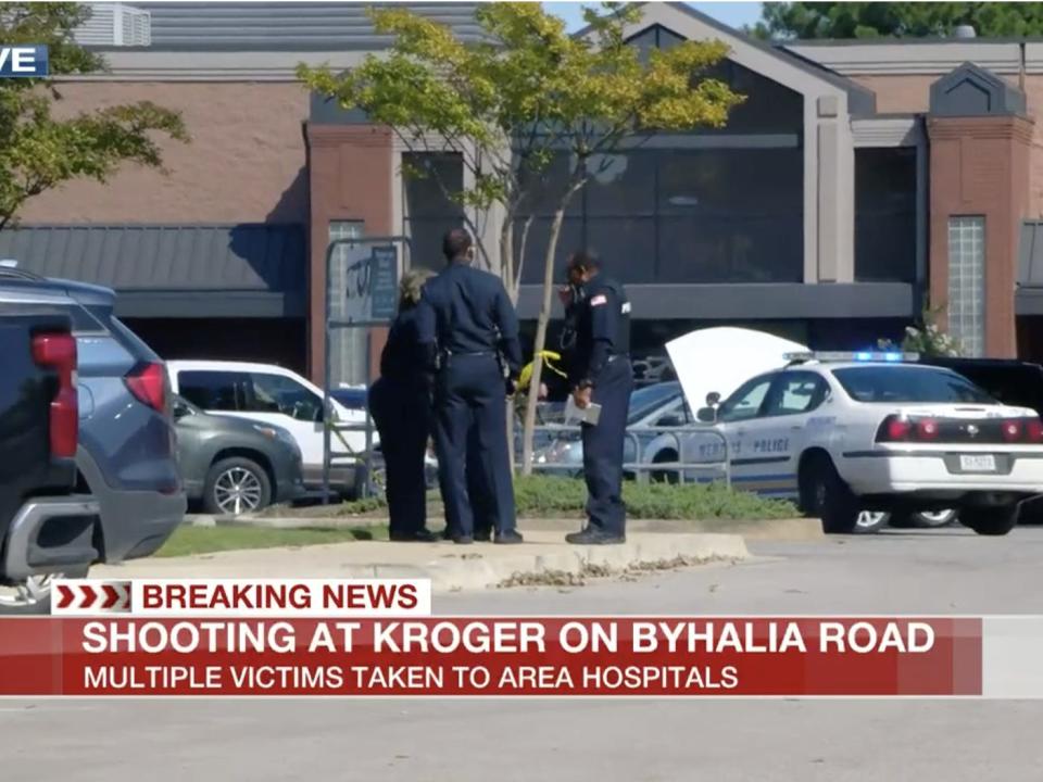 Police outside the scene of a mass shooting at a Kroger supermarket in Collierville, Tennessee.