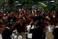 People dressed in folk costumes take part in a traditional wedding ceremony in the village of Galicnik, west of capital Skopje, Macedonia July 15, 2018. REUTERS/Ognen Teofilovski