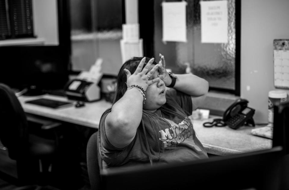 A staff member at Alamo Women's Reproductive Services in San Antonio wipes away tears