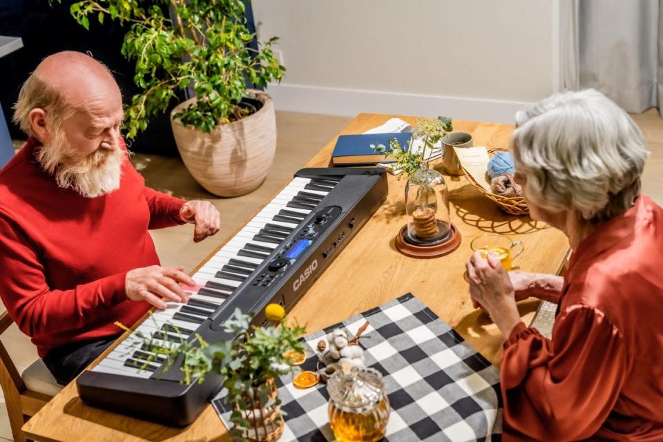 Care home residents with dementia playing the keyboard (MHA/Casio/PA)