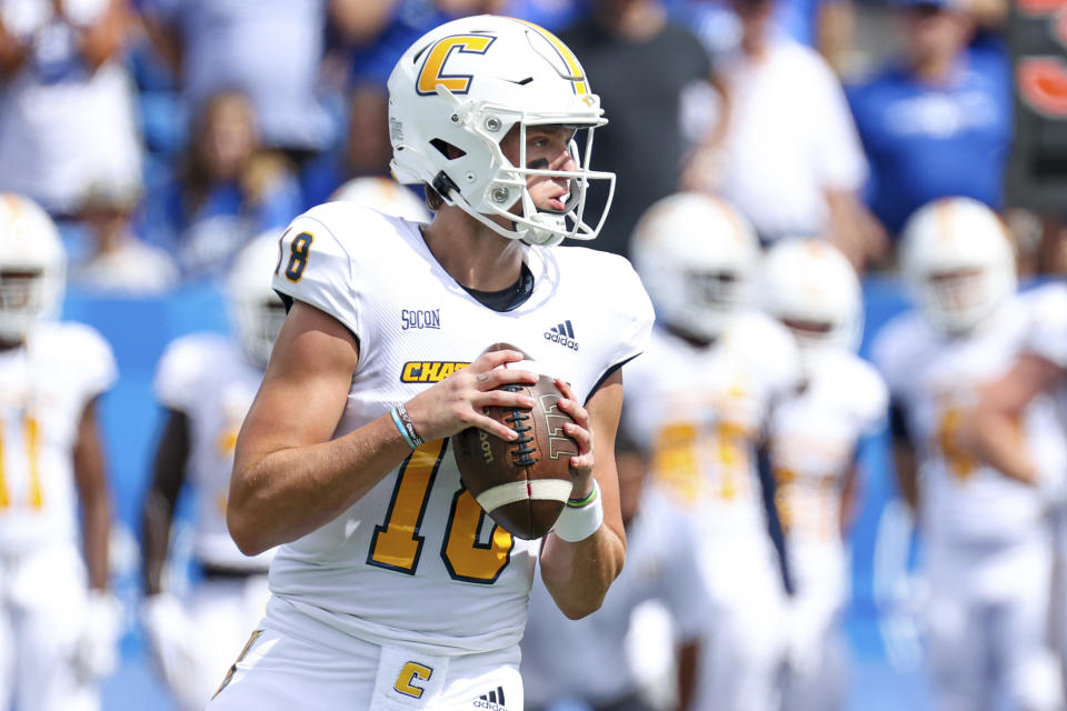 Chattanooga quarterback Cole Copeland (18) looks for an open receiver during the first half of a NCAA college football game against Kentucky in Lexington, Ky., Saturday, Sept. 18, 2021. (AP Photo/Michael Clubb)