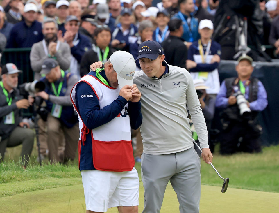Matthew Fitzpatrick (pictured right) smiles and embraces his caddie Billy Foster (pictured left) after winning the US Open.