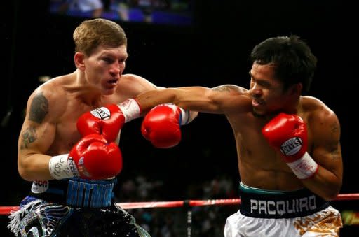 Manny Pacquiao of the Philippines (right) throws a right to the face of England's Ricky Hatton in the first round of their junior welterweight title fight on May 2, 2009 in Las Vegas. Hatton says he has put his drugs, drink and depression nightmare behind him as he relishes his new life outside the ring as a promoter