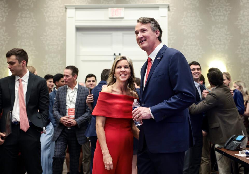 Glenn Youngkin and his wife, Suzanne, watch results come in on election night at the Westfields Marriott Washington Dulles on Tuesday in Chantilly, Va. Youngkin defeated Democrat Terry McAuliffe to become Virginia's next governor.