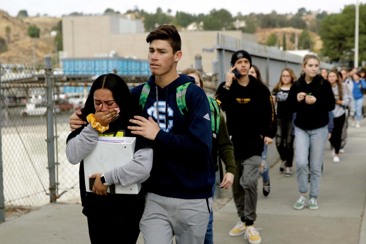 Students are escorted out of Saugus High School: AP