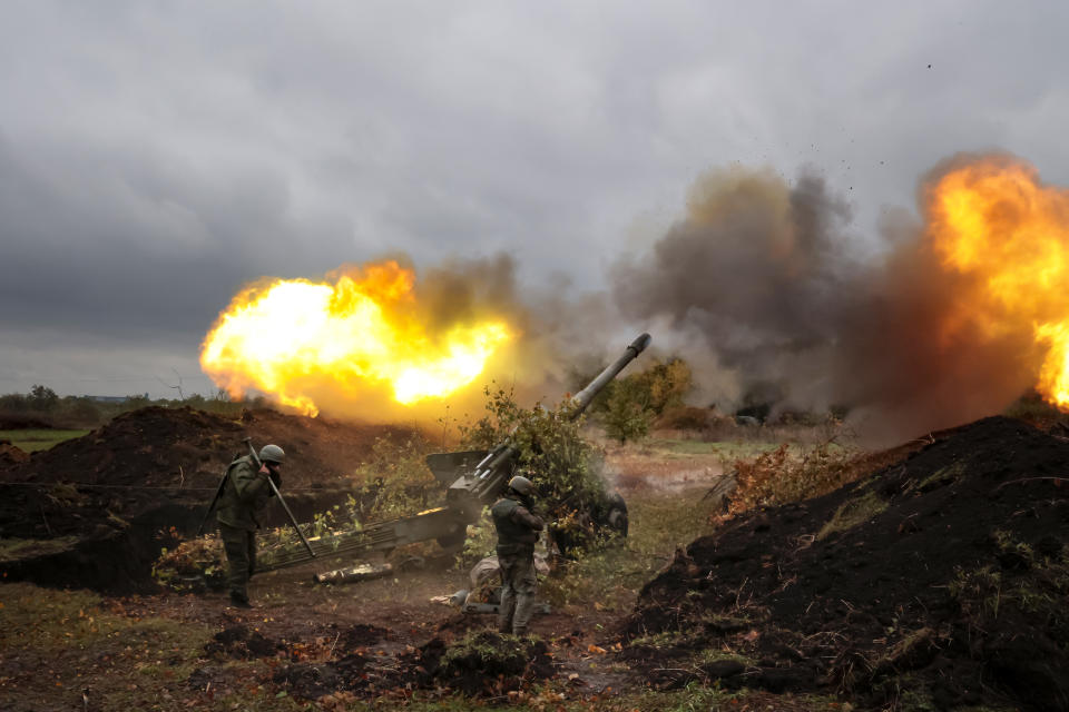 FILE - Servicemen fire artillery from their position at Ukrainian troops at an undisclosed location in the Russian-controlled Donetsk region of eastern Ukraine, on Oct. 11, 2022. Russia and Ukraine both hope to turn the tide of the yearlong war with big offensives. (AP Photo/Alexei Alexandrov, File)