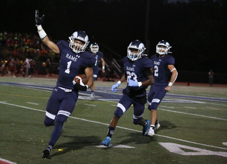 Randolph's Jesse Wilfong celebrates his interception against Mount Olive during the first half of a football game at Randolph High School September 02, 2022.