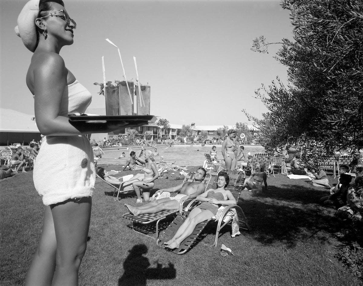 A scene at the Sahara swimming pool with sun bathers and a waitress August 20, 1954. (Las Vegas News Bureau Collection, LVCVA Archive)