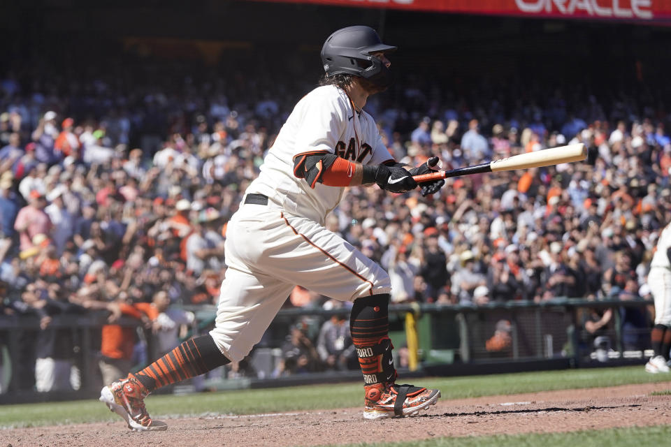 San Francisco Giants' Brandon Crawford watches his RBI single that scored Brandon Belt during the ninth inning of a baseball game against the Arizona Diamondbacks in San Francisco, Wednesday, July 13, 2022. (AP Photo/Jeff Chiu)