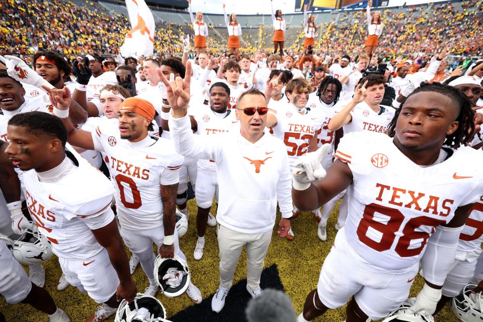 ANN ARBOR, MICHIGAN - SEPTEMBER 07: Head coach Steve Sarkisian of the Texas Longhorns celebrates with his team after a 31-12 victory against the Michigan Wolverines at Michigan Stadium on September 07, 2024 in Ann Arbor, Michigan. (Photo by Gregory Shamus/Getty Images)