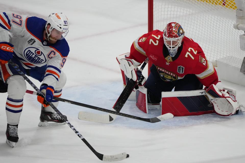 Jun 8, 2024; Sunrise, Florida, USA; Edmonton Oilers forward Connor McDavid (97) shoots the puck against Florida Panthers goaltender Sergei Bobrovsky (72) during the first period in game one of the 2024 Stanley Cup Final at Amerant Bank Arena. Mandatory Credit: Jim Rassol-USA TODAY Sports