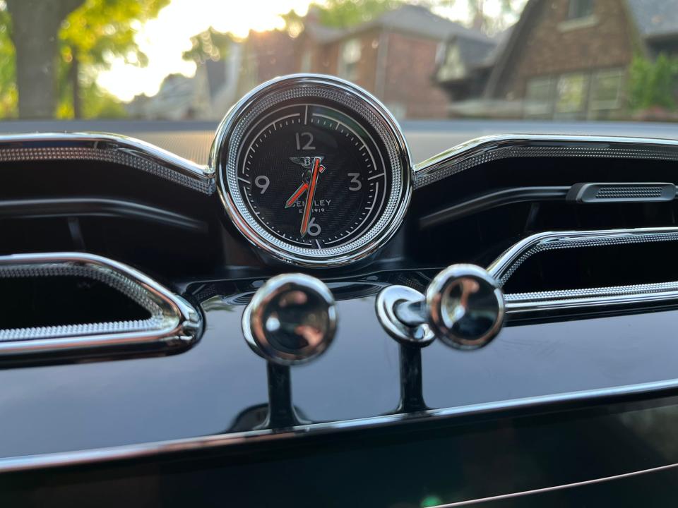 2An analog clock and 'organ stop' vent controls recall early Bentleys.