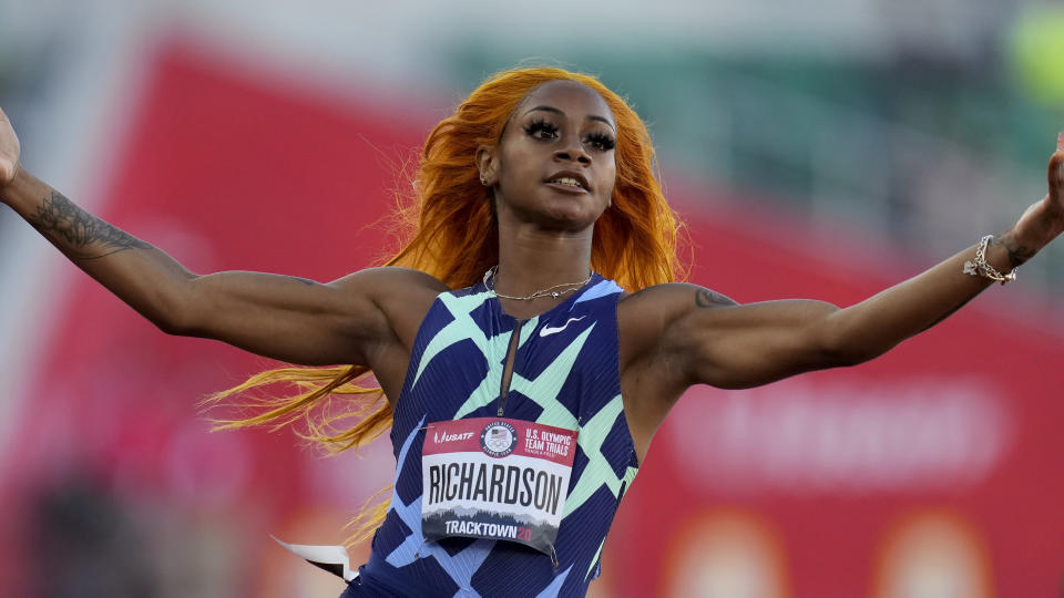 Sha'Carri Richardson celebrates after winning the fourth heat during the women's 100-meter run at the U.S. Olympic Track and Field Trials Friday, June 18, 2021, in Eugene, Ore. (AP Photo/Ashley Landis)