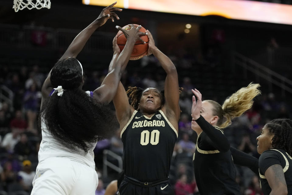 Colorado guard Jaylyn Sherrod (0) grabs a rebound against LSU during the first half of an NCAA college basketball game Monday, Nov. 6, 2023, in Las Vegas. (AP Photo/John Locher)