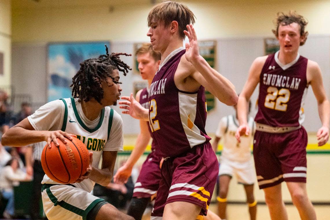 Foss guard Jamie Killian-Howard drives to the basket as Enumclaw guard Wyatt Neu defends during the third quarter of 2A SPSL game on Tuesday, Jan. 24, 2023, in Tacoma, Wash.