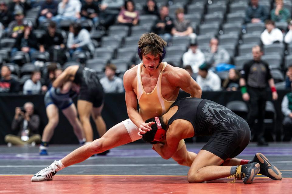 Fort Collins wrestler Jude Miller grapples with Pomona's DJ Wince during his match at the Colorado state wrestling tournament at Ball Arena in Denver on Saturday.