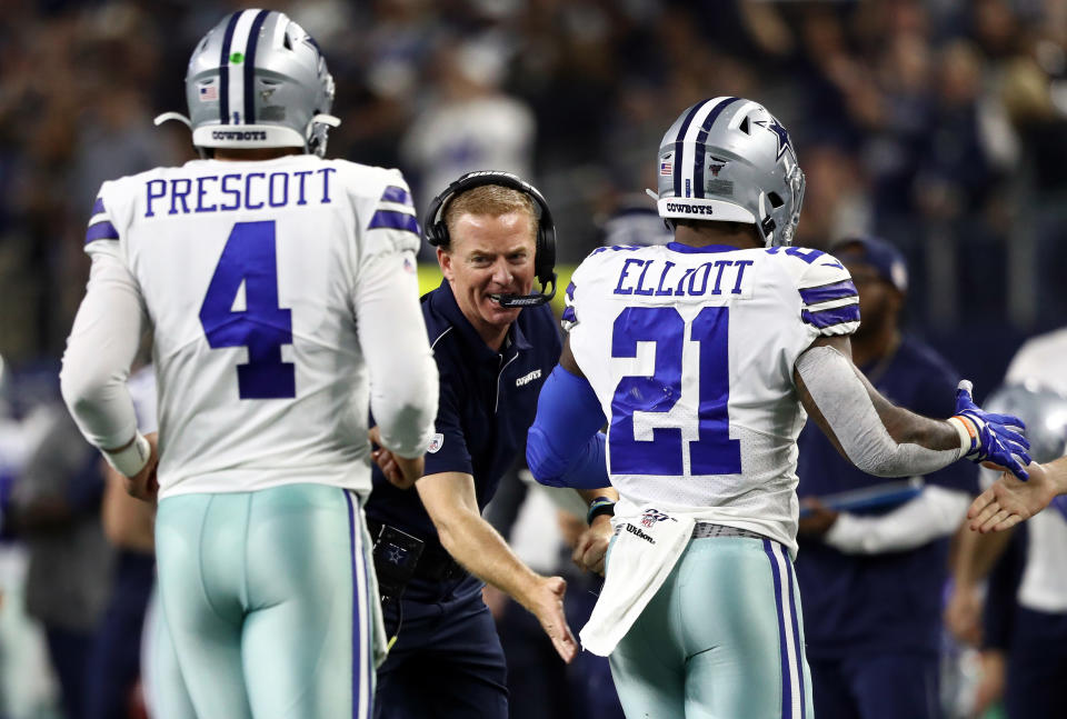 ARLINGTON, TEXAS - NOVEMBER 28:  Head coach Jason Garrett of the Dallas Cowboys celebrates a touchdown with Dak Prescott #4 and Ezekiel Elliott #21 against the Buffalo Bills at AT&T Stadium on November 28, 2019 in Arlington, Texas. (Photo by Ronald Martinez/Getty Images)