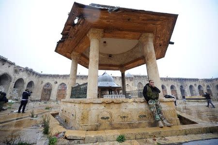 Forces loyal to Syria's President Bashar al-Assad stand inside the Umayyad mosque, in the government-controlled area of Aleppo, during a media tour, Syria December 13, 2016. REUTERS/Omar Sanadiki