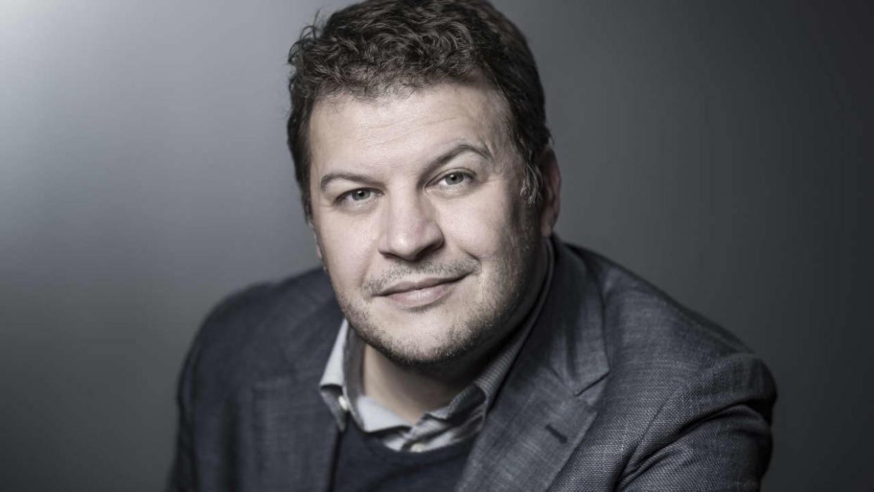 French writer Guillaume Musso poses during a photo session in Paris on April 12, 2018. (Photo by JOEL SAGET / AFP)