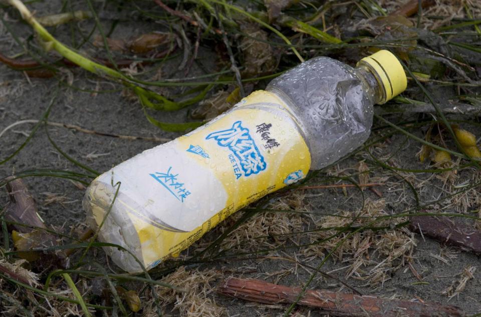 A bottle is clearly labelled with Japanese writing. According to the NOAA, the Japanese government estimated that the tsunami swept about 5 million tonnes of debris into the Pacific Ocean.