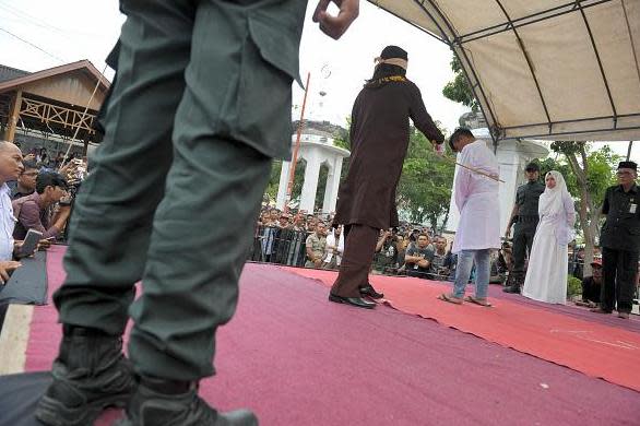 A file image of a man being flogged in Aceh, Indonesia: AFP/Getty Images