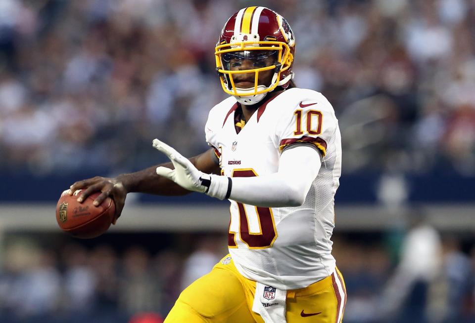 Robert Griffin III #10 of the Washington Redskins throws the ball against the Dallas Cowboys during a Thanksgiving Day game at Cowboys Stadium on November 22, 2012 in Arlington, Texas. (Photo by Ronald Martinez/Getty Images)