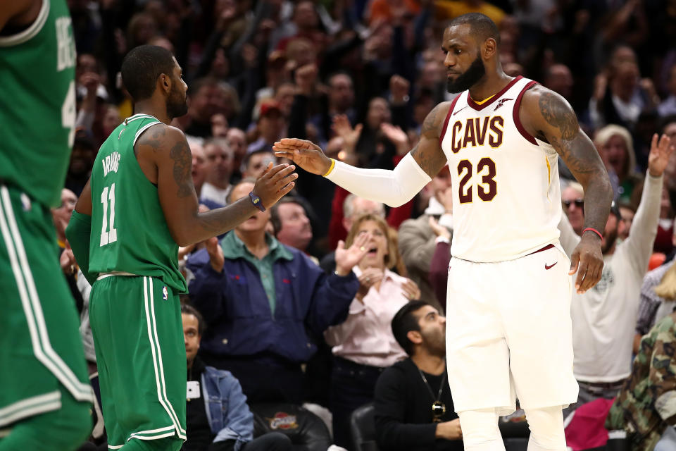 LeBron James and Kyrie Irving exchange pleasantries. (Getty)