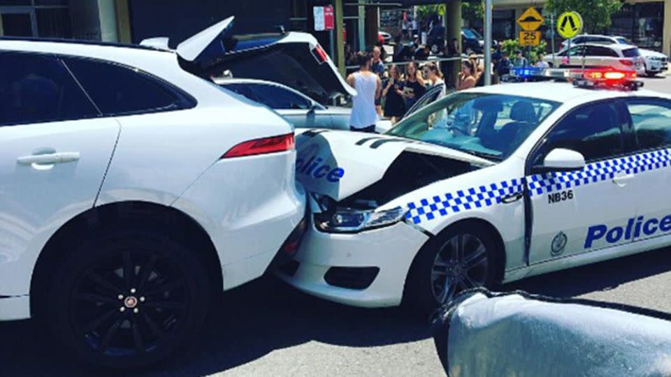 The luxury Jaguar reportedly reversed into the Sydney police car. Source: Instagram