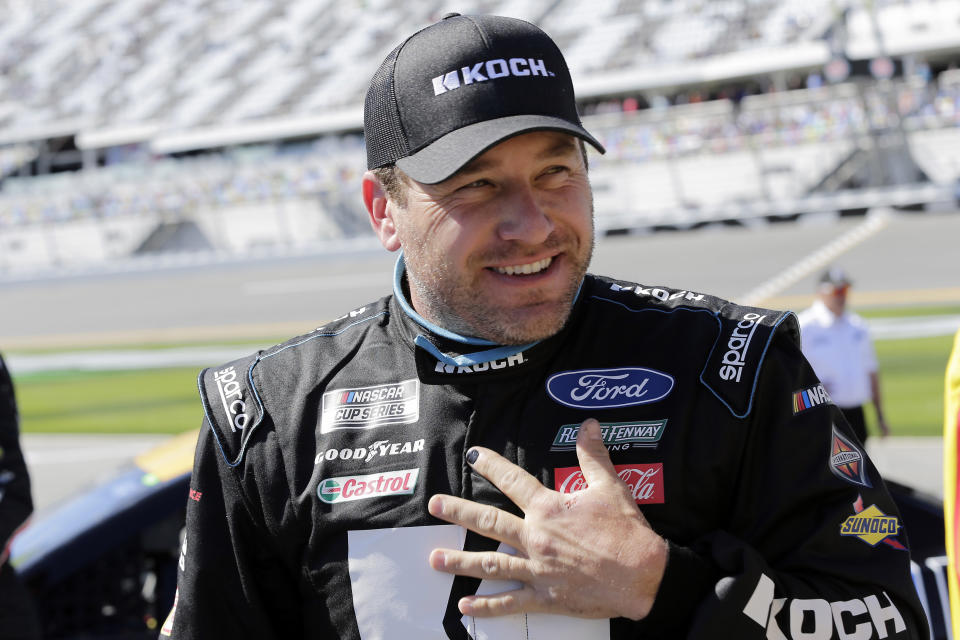 FILE - In this Feb. 9, 2020, file photo, Ryan Newman stands on pit road after his run during NASCAR auto racing qualifying at Daytona International Speedway in Daytona Beach, Fla. Ryan Newman is fully alert, walking around the hospital and joking with staff two days after his frightening crash on the final lap of the Daytona 500. Roush Fenway Racing said Wednesday, Feb. 19, 2020, the 42-year-old driver “continues to show great improvement.” (AP Photo/Terry Renna, File)