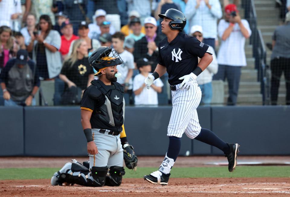 Mar 20, 2024; Tampa, Florida, USA; New York Yankees shortstop Anthony Volpe (11) runs past home plate after he hit a home run during the first inning against the Pittsburgh Pirates at George M. Steinbrenner Field. Mandatory Credit: Kim Klement Neitzel-USA TODAY Sports