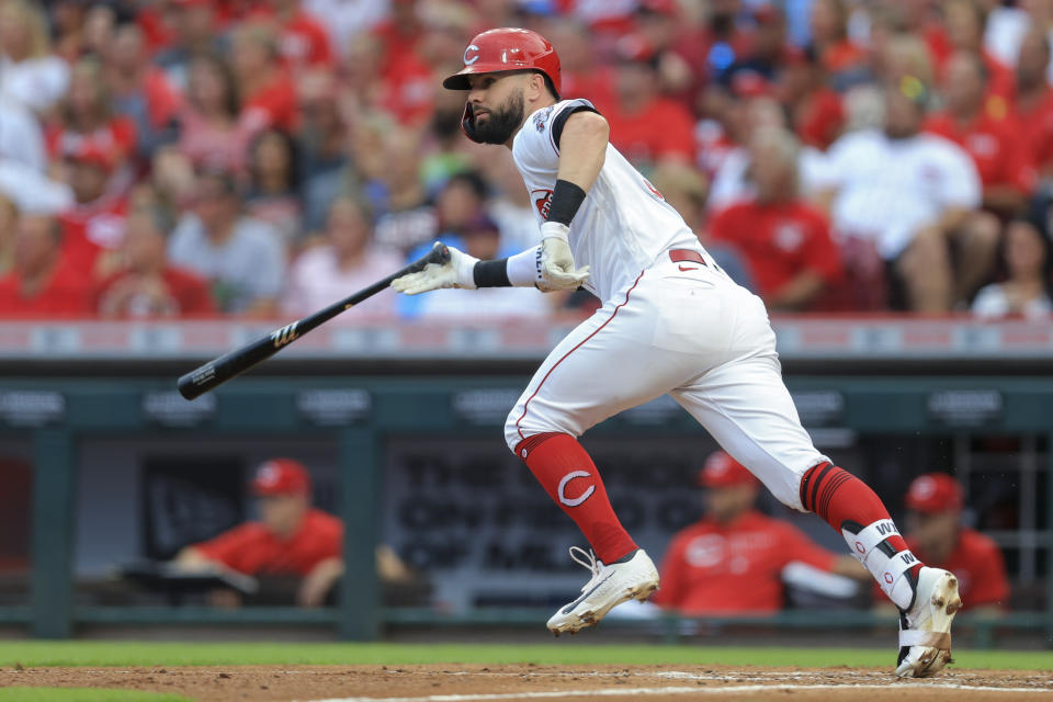 Cincinnati Reds' Jesse Winker heads to first on a two-run double during the second inning of the team's baseball game against the St. Louis Cardinals in Cincinnati, Saturday, July 24, 2021. (AP Photo/Aaron Doster)