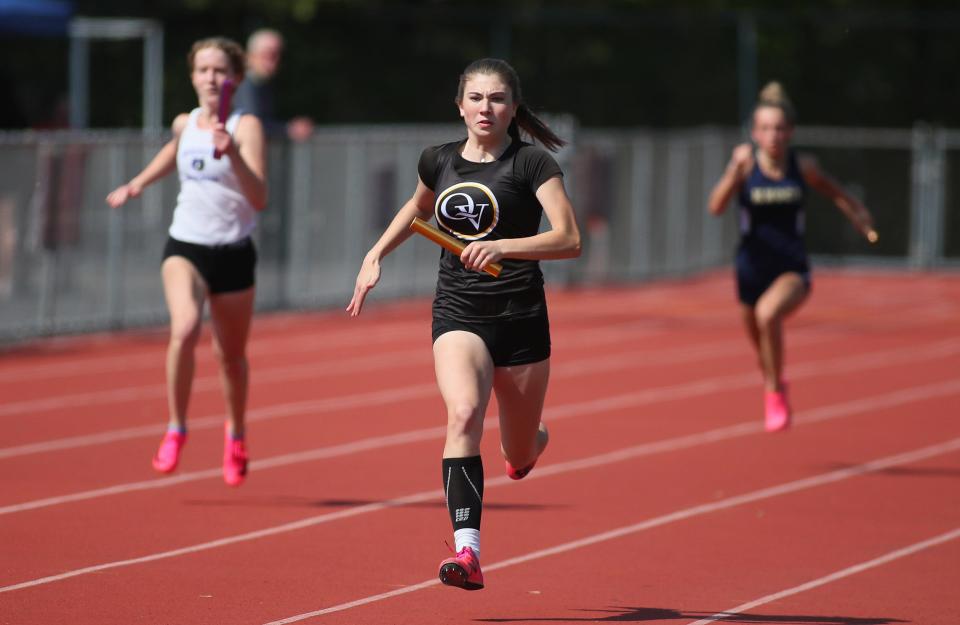 Quaker Valley's Nora Johns eyes up the finish line while in first place in the 4x100 relay during the WPIAL 2A Track and Field Championship Tuesday evening at Peters Township High School.