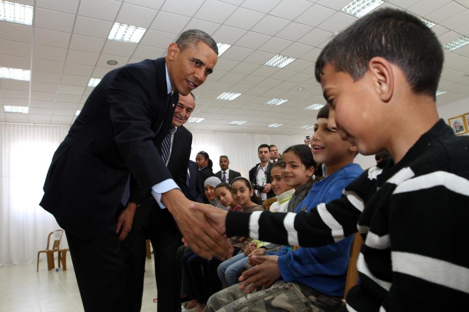 Obama shakes hands with Palestinian children during his visit to Al Bera Youth Center in the West Bank in March 2013. (Photo: Pool via Getty Images)
