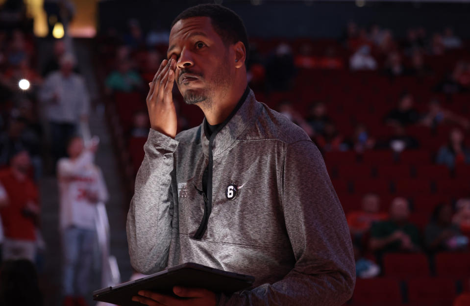 zDec 13, 2022; Houston, Texas, USA; Houston Rockets head coach Stephen Silas wipes away a tear as he listens to the Rockets starting lineup introduced before playing against the Phoenix Suns at Toyota Center. Silas was out last game attending his dads funeral. Mandatory Credit: Thomas Shea-USA TODAY Sports