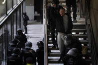 Rap singer Pablo Hasel is detained by police officers at the University of Lleida, Spain, Tuesday, Feb. 16, 2021. The imprisonment of Pablo Hasel for inciting terrorism and refusing to pay a fine after having insulted the country's monarch has triggered a social debate and street protests. (AP Photo/Joan Mateu)