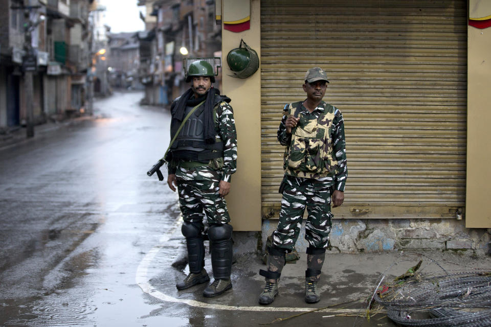 Indian paramilitary soldiers stand guard during security lockdown in Srinagar, Indian controlled Kashmir, Wednesday, Aug. 14, 2019. India has maintained an unprecedented security lockdown to try to stave off a violent reaction to Kashmir's downgraded status. Protests and clashes have occurred daily, thought the curfew and communications blackout have meant the reaction is largely subdued. (AP Photo/ Dar Yasin)