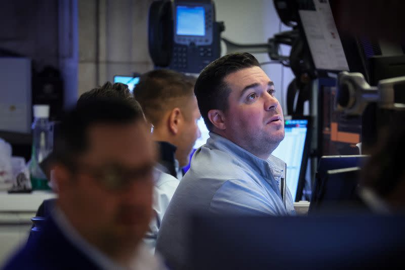 Traders work on the floor of the NYSE in New York