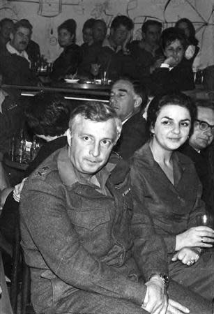 Israeli Major General in the Reserves Ariel Sharon (L) and his wife Lily sit together during a party January 12, 1969 in this picture released by Israel's Defence Ministry. REUTERS/Israeli Defence Ministry/Handout