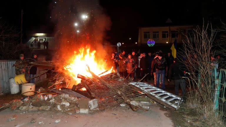 The protesters started fires and erected a barricade in the road