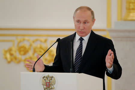 Russian President Vladimir Putin delivers a speech during the awarding ceremony for Russian Olympic medallists returning home from the 2016 Rio Olympics, at the Kremlin in Moscow, Russia August 25, 2016. REUTERS/Maxim Shemetov