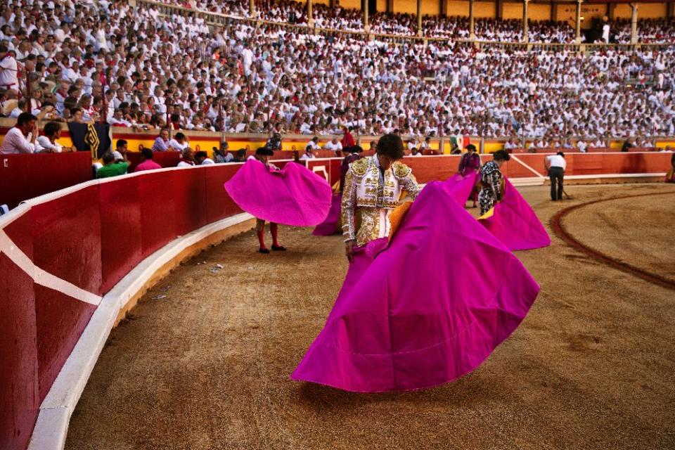 Bullfighters warm up before a bullfight of the San Fermin festival, in Pamplona, Spain, Sunday, July 7, 2013. Revelers from around the world arrive to Pamplona every year to take part on some of the eight days of the running of the bulls glorified by Ernest Hemingway's 1926 novel "The Sun Also Rises." (AP Photo/Daniel Ochoa de Olza)