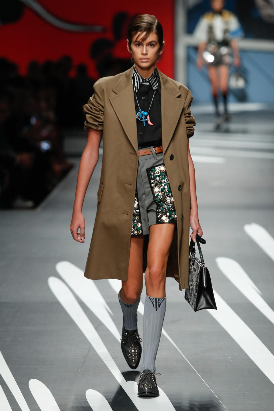 <p>The fashion week newbie showed off her mile-long legs in an embellished mini at Prada's MFW show.</p>